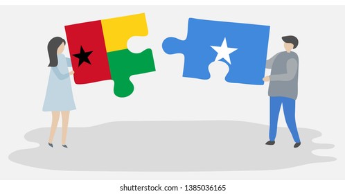 Couple holding two puzzles pieces with Bissau-Guinean and Somali flags. Guinea-Bissau and Somalia national symbols together.