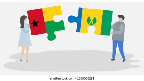 Couple holding two puzzles pieces with Bissau-Guinean and Vincentian flags. Guinea-Bissau and Saint Vincent and the Grenadines national symbols together.