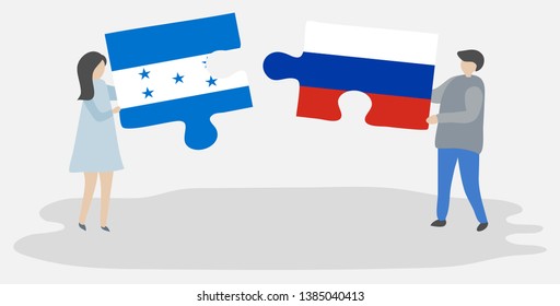 Couple holding two puzzles pieces with Honduran and Russian flags. Honduras and Russia national symbols together.