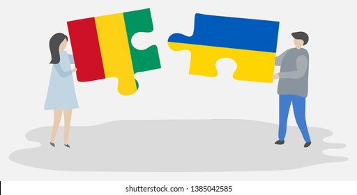 Couple holding two puzzles pieces with Guinean and Ukrainian flags. Guinea and Ukraine national symbols together.