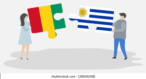 Couple holding two puzzles pieces with Guinean and Uruguayan flags. Guinea and Uruguay national symbols together.