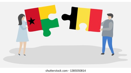 Couple holding two puzzles pieces with Bissau-Guinean and Belgian flags. Guinea-Bissau and Belgium national symbols together.