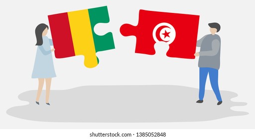 Couple holding two puzzles pieces with Guinean and Tunisian flags. Guinea and Tunisia national symbols together.