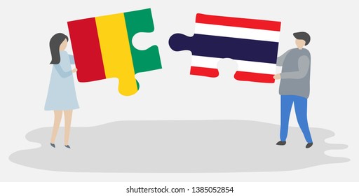 Couple holding two puzzles pieces with Guinean and Thai flags. Guinea and Thailand national symbols together.