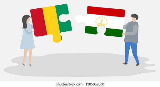Couple holding two puzzles pieces with Guinean and Tajikistani flags. Guinea and Tajikistan national symbols together.