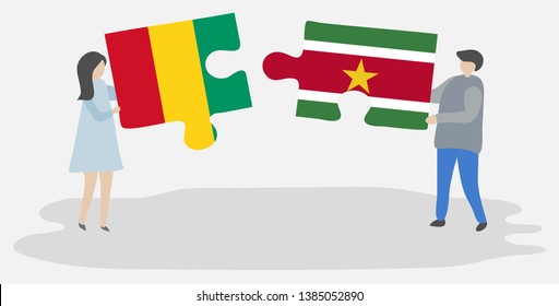 Couple holding two puzzles pieces with Guinean and Surinamese flags. Guinea and Suriname national symbols together.