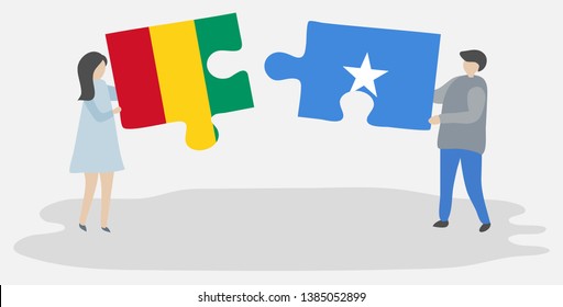 Couple holding two puzzles pieces with Guinean and Somali flags. Guinea and Somalia national symbols together.