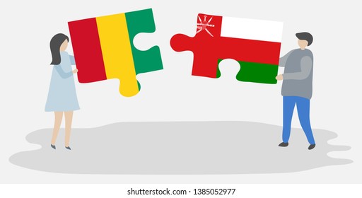 Couple holding two puzzles pieces with Guinean and Omani flags. Guinea and Oman national symbols together.
