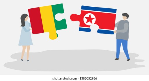 Couple holding two puzzles pieces with Guinean and North Korean flags. Guinea and North Korea national symbols together.
