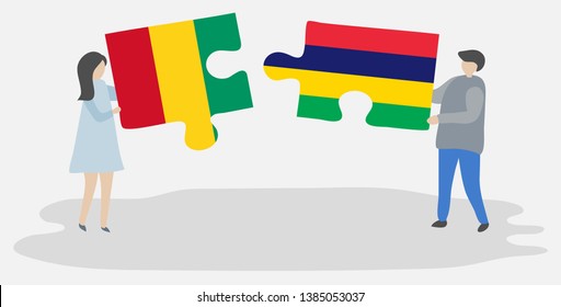 Couple holding two puzzles pieces with Guinean and Mauritian flags. Guinea and Mauritius national symbols together.