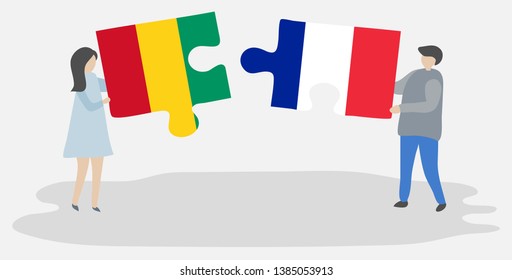 Couple holding two puzzles pieces with Guinean and French flags. Guinea and France national symbols together.