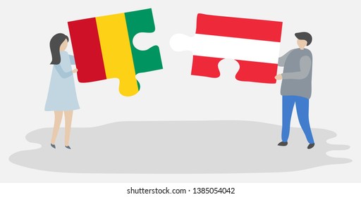 Couple holding two puzzles pieces with Guinean and Austrian flags. Guinea and Austria national symbols together.