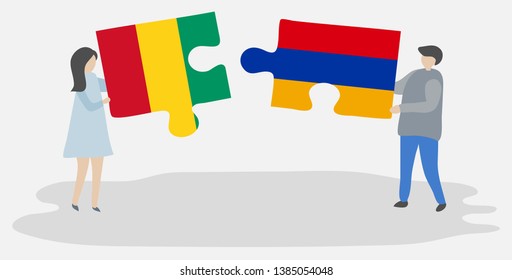 Couple holding two puzzles pieces with Guinean and Armenian flags. Guinea and Armenia national symbols together.