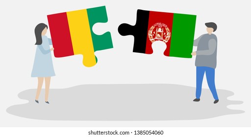 Couple holding two puzzles pieces with Guinean and Afghan flags. Guinea and Afghanistan national symbols together.