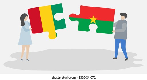 Couple holding two puzzles pieces with Guinean and Burkinabe flags. Guinea and Burkina Faso national symbols together.