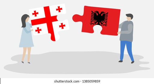 Couple holding two puzzles pieces with Georgian and Albanian flags. Georgia and Albania national symbols together.