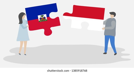Couple holding two puzzles pieces with Haitian and Indonesian flags. Haiti and Indonesia national symbols together.