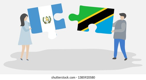 Couple holding two puzzles pieces with Guatemalan and Tanzanian flags. Guatemala and Tanzania national symbols together.