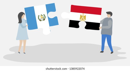 Couple holding two puzzles pieces with Guatemalan and Egyptian flags. Guatemala and Egypt national symbols together.