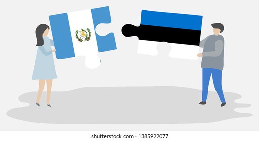 Couple holding two puzzles pieces with Guatemalan and Estonian flags. Guatemala and Estonia national symbols together.