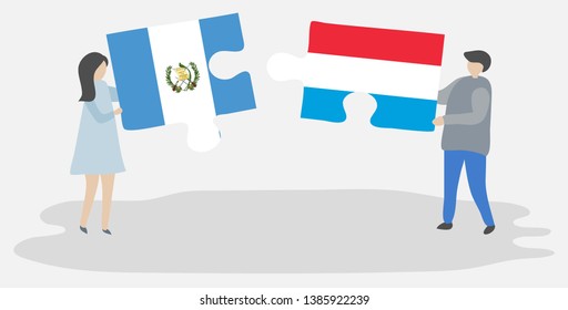 Couple holding two puzzles pieces with Guatemalan and Luxembourgish flags. Guatemala and Luxembourg national symbols together.