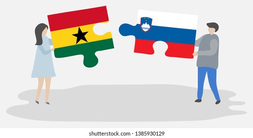 Couple holding two puzzles pieces with Ghanaian and Slovenian flags. Ghana and Slovenia national symbols together.