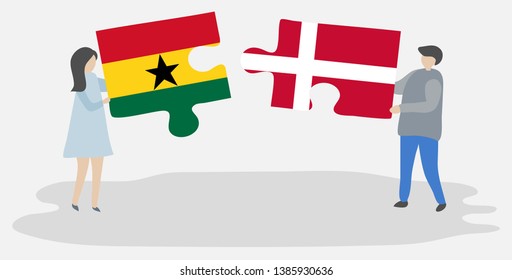 Couple holding two puzzles pieces with Ghanaian and Danish flags. Ghana and Denmark national symbols together.