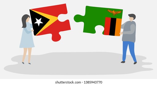 Couple holding two puzzles pieces with Timorese and Zambian flags. East Timor and Zambia national symbols together.