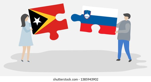 Couple holding two puzzles pieces with Timorese and Slovenian flags. East Timor and Slovenia national symbols together.