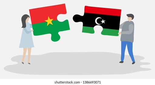 Couple holding two puzzles pieces with Burkinabe and Libyan flags. Burkina Faso and Libya national symbols together.
