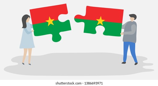 Couple holding two puzzles pieces with Burkinabe and Burkinabe flags. Burkina Faso and Burkina Faso national symbols together.