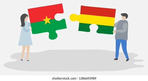 Couple holding two puzzles pieces with Burkinabe and Bolivian flags. Burkina Faso and Bolivia national symbols together.