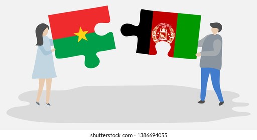 Couple holding two puzzles pieces with Burkinabe and Afghan flags. Burkina Faso and Afghanistan national symbols together.