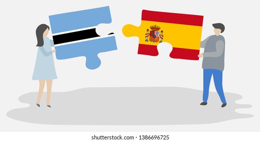 Couple holding two puzzles pieces with Motswana and Spanish flags. Botswana and Spain national symbols together.