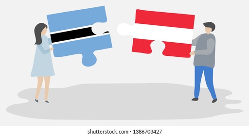 Couple holding two puzzles pieces with Motswana and Austrian flags. Botswana and Austria national symbols together.