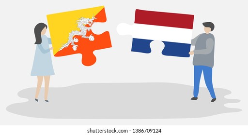 Couple holding two puzzles pieces with Bhutanese and Dutch flags. Bhutan and Netherlands national symbols together.