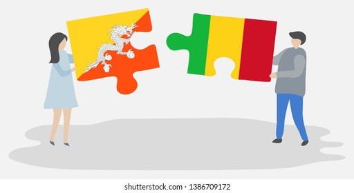 Couple holding two puzzles pieces with Bhutanese and Malian flags. Bhutan and Mali national symbols together.
