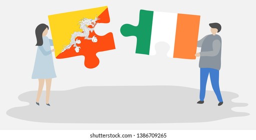 Couple holding two puzzles pieces with Bhutanese and Irish flags. Bhutan and Ireland national symbols together.