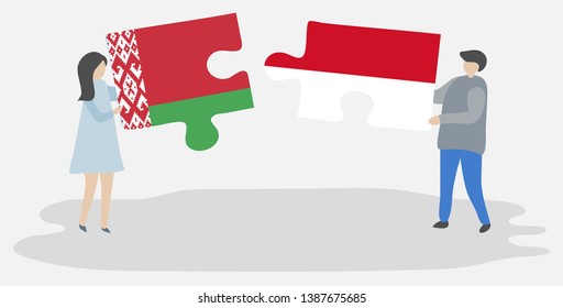 Couple holding two puzzles pieces with Belarusian and Indonesian flags. Belarus and Indonesia national symbols together.
