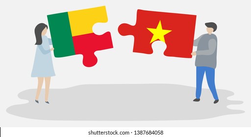 Couple holding two puzzles pieces with Beninese and Vietnamese flags. Benin and Vietnam national symbols together.