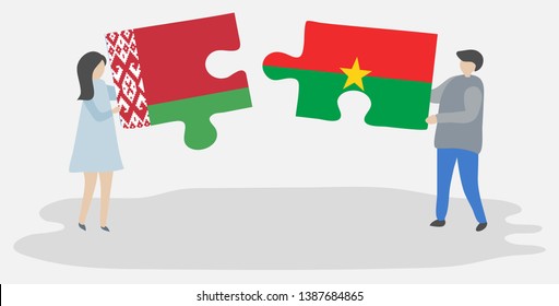 Couple holding two puzzles pieces with Belarusian and Burkinabe flags. Belarus and Burkina Faso national symbols together.