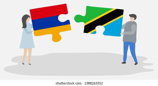 Couple holding two puzzles pieces with Armenian and Tanzanian flags. Armenia and Tanzania national symbols together.