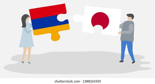 Couple holding two puzzles pieces with Armenian and Japanese flags. Armenia and Japan national symbols together.