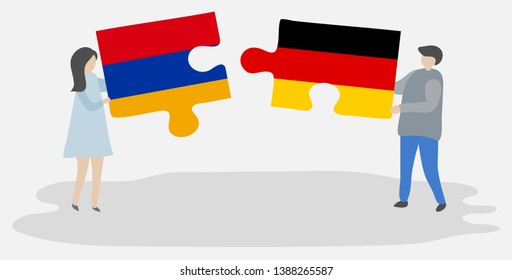 Couple holding two puzzles pieces with Armenian and German flags. Armenia and Germany national symbols together.
