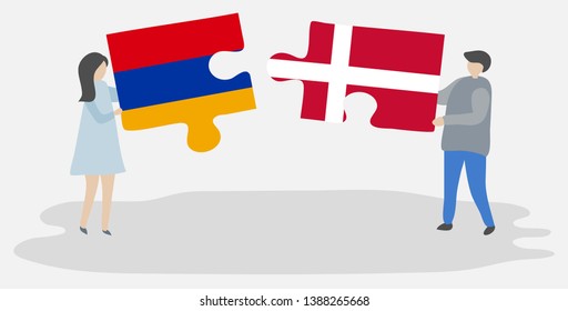 Couple holding two puzzles pieces with Armenian and Danish flags. Armenia and Denmark national symbols together.