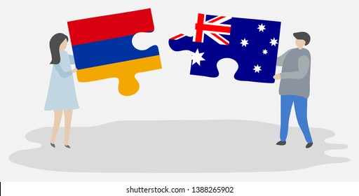 Couple holding two puzzles pieces with Armenian and Australian flags. Armenia and Australia national symbols together.