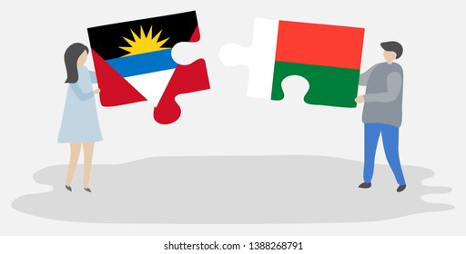 Couple holding two puzzles pieces with Antiguan and Malagasy flags. Antigua and Barbuda and Madagascar national symbols together.