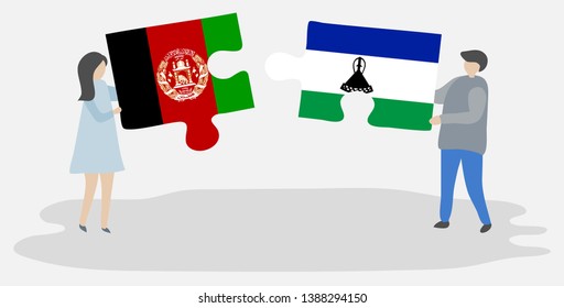 Couple holding two puzzles pieces with Afghan and Basotho flags. Afghanistan and Lesotho national symbols together.