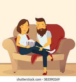 Couple at home sitting on couch and watching movie
