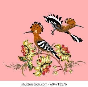 A couple of hoopoes on flowering branches